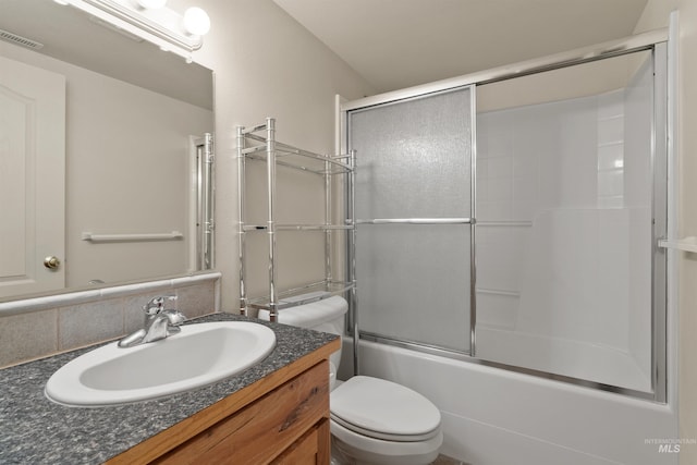 1141 Liberty Dr, Clarkston, WA 99403 - full bathroom with toilet, vanity, and enclosed tub / shower combo