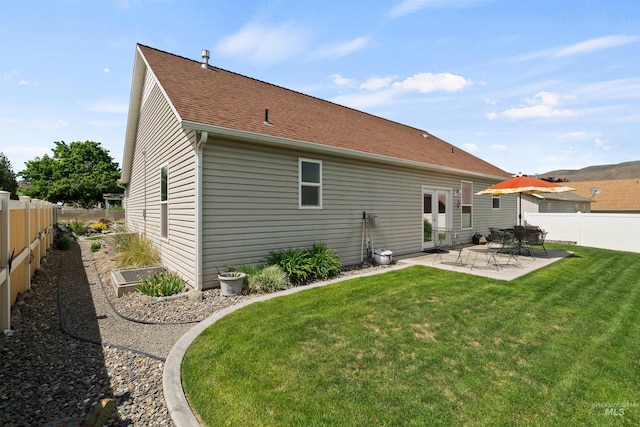 1141 Liberty Dr, Clarkston, WA 99403 - rear view of house with a patio area and a shingled roof