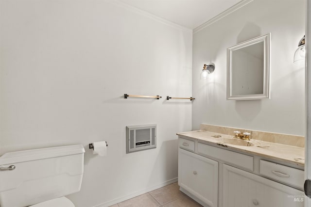 half bath with heating unit, toilet, vanity, ornamental molding, and tile patterned floors