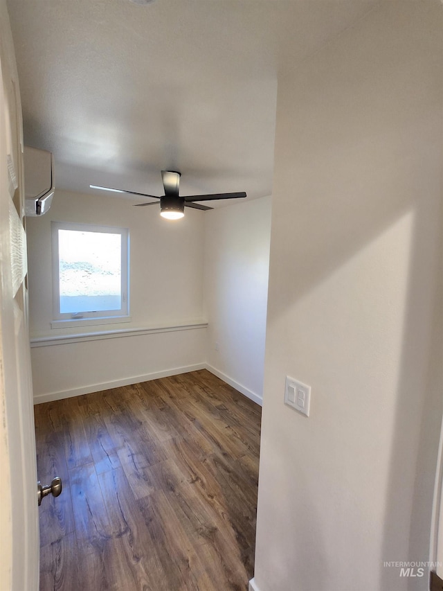 427 204 S Main St, Moscow, ID 83843 - unfurnished room with wood finished floors, ceiling fan, and a wall unit AC