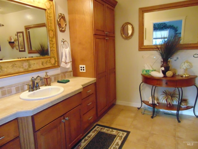 bathroom with tile patterned flooring and vanity