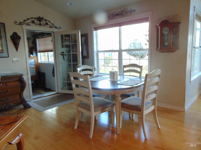 dining space featuring light wood-type flooring