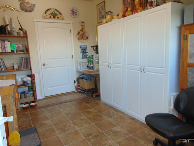 misc room with tile patterned flooring