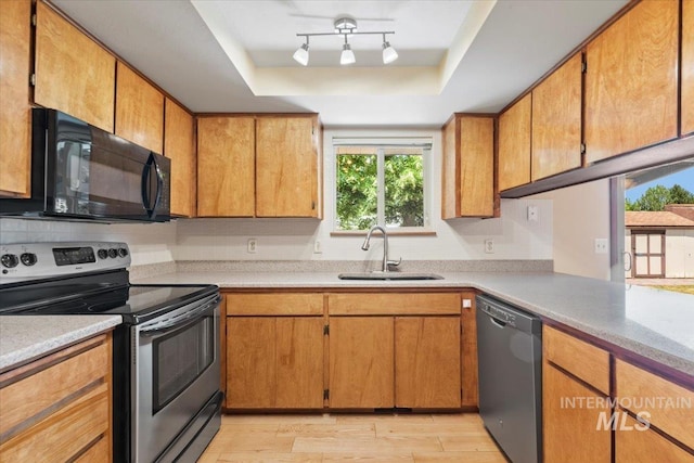 3493 N Buckboard Way, Boise, ID 83713 - kitchen featuring stainless steel range with electric stovetop, black microwave, dishwasher, a tray ceiling, and light wood-type flooring