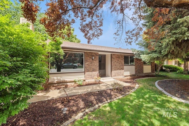 3493 N Buckboard Way, Boise, ID 83713 - ranch-style home with brick siding and a front yard