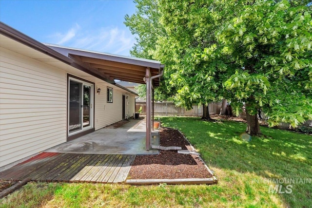 3493 N Buckboard Way, Boise, ID 83713 - fenced backyard featuring a deck and a patio area