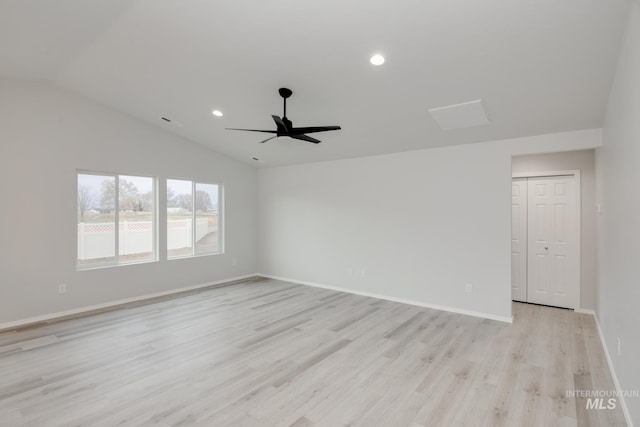 empty room with a ceiling fan, baseboards, light wood finished floors, lofted ceiling, and recessed lighting