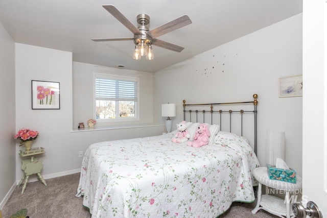 bedroom with ceiling fan, carpet flooring, and baseboards