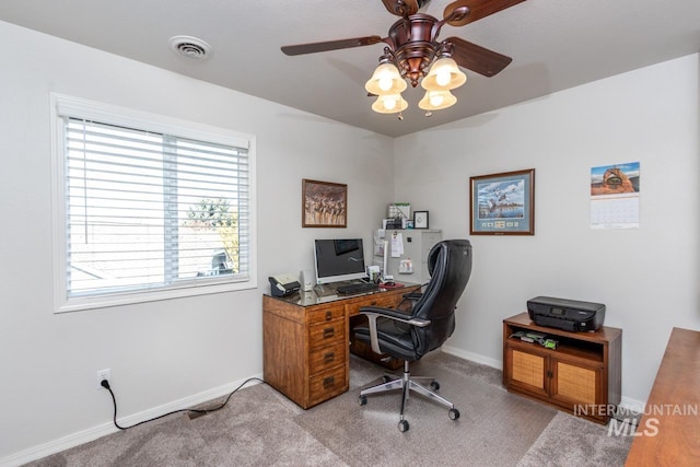 office area featuring carpet floors, visible vents, ceiling fan, and baseboards