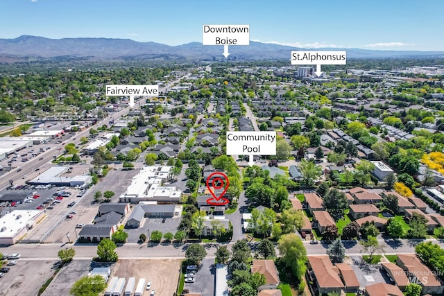birds eye view of property featuring a mountain view