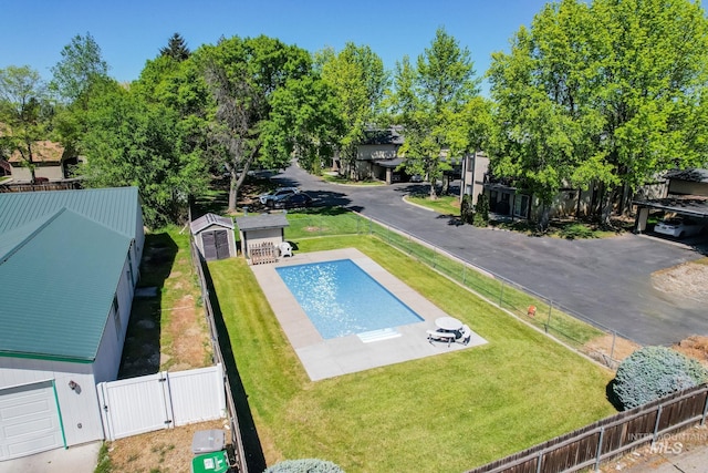 view of pool featuring a fenced in pool, a gate, a fenced backyard, and a yard