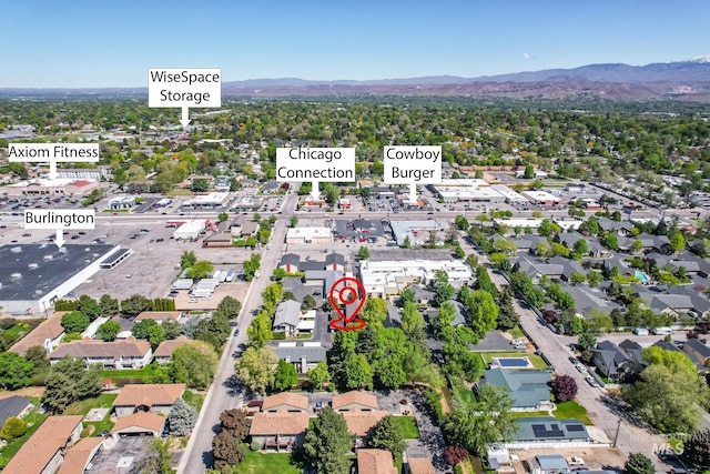 birds eye view of property with a residential view and a mountain view