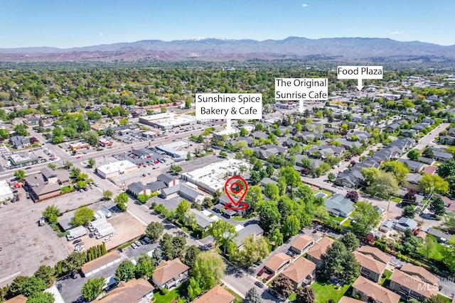 birds eye view of property with a mountain view