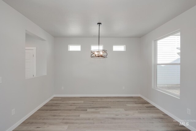 3566 W Littleton Dr, Meridian, ID 83642 - unfurnished dining area featuring light wood-type flooring