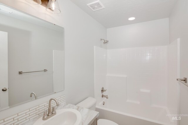 3566 W Littleton Dr, Meridian, ID 83642 - full bathroom featuring vanity, bathing tub / shower combination, toilet, and tasteful backsplash