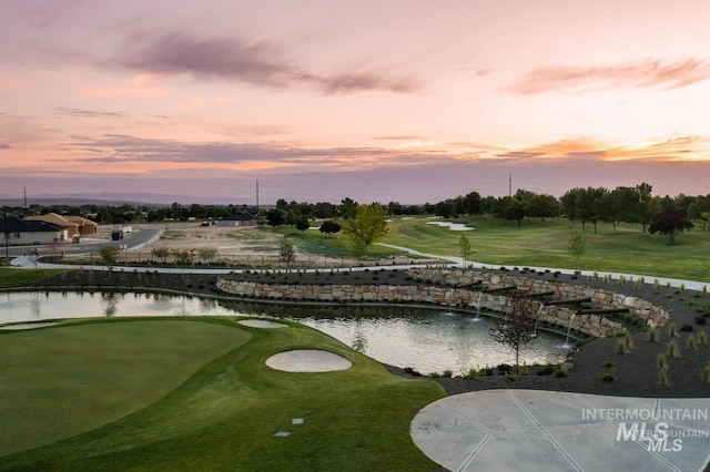 11966 W Zamalek Ct, Kuna, ID 83634 - view of community featuring golf course view, a water view, and a putting area