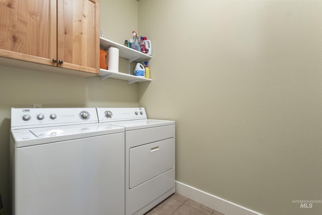 2310 W Herron Loop, Nampa, ID 83686 - laundry room featuring washing machine and clothes dryer, cabinet space, and light tile patterned flooring
