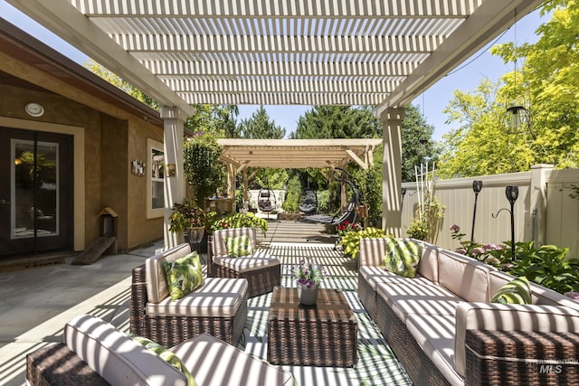 2310 W Herron Loop, Nampa, ID 83686 - fenced backyard with a pergola, outdoor lounge area, and a patio area