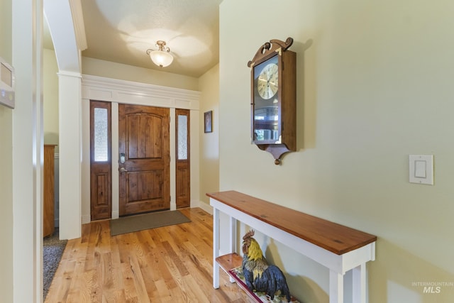 2310 W Herron Loop, Nampa, ID 83686 - foyer entrance with light wood-style floors and baseboards
