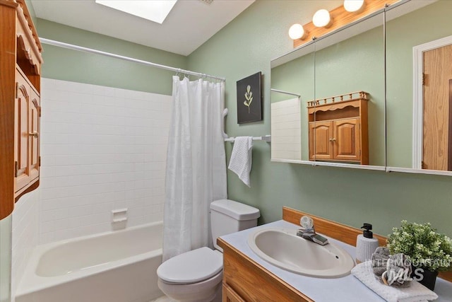 full bathroom featuring shower / tub combo, vanity, a skylight, and toilet