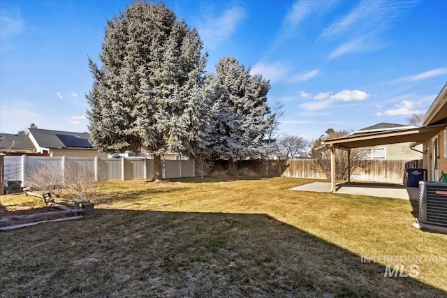 view of yard with a patio area and central air condition unit