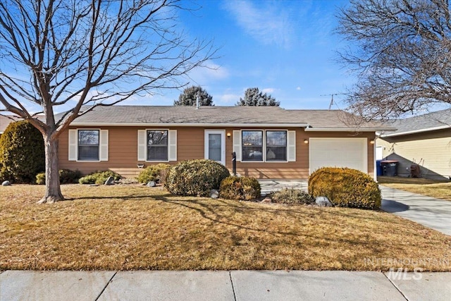 single story home with a garage and a front yard