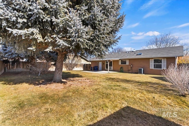 view of yard with central AC unit and a patio area