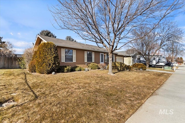 ranch-style home with a front yard