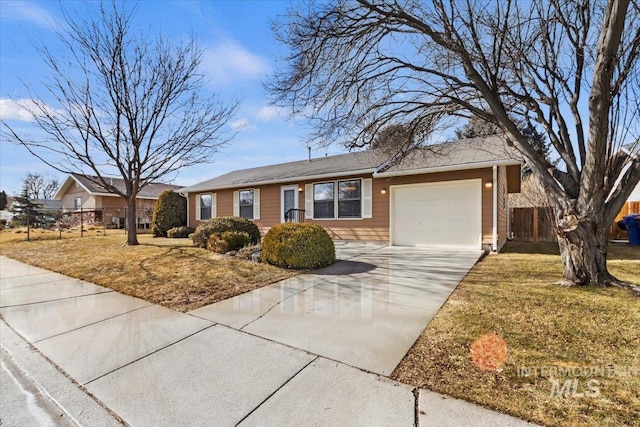 ranch-style home featuring a garage and a front lawn