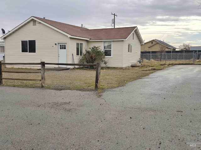 view of front of house with fence