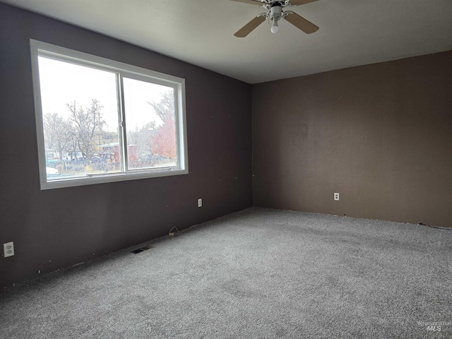 carpeted empty room with ceiling fan