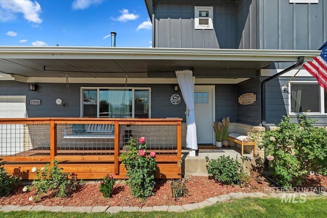 15916 Hill Top Cir, Wilder, ID 83676 - view of front facade with a porch and board and batten siding