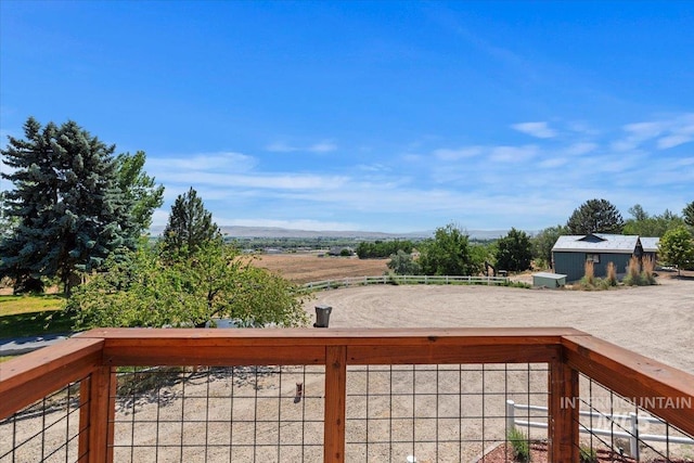 15916 Hill Top Cir, Wilder, ID 83676 - wooden terrace featuring a view of countryside