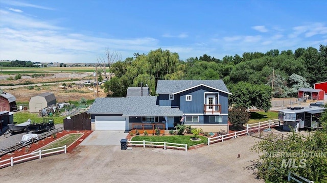 15916 Hill Top Cir, Wilder, ID 83676 - view of front of house featuring an attached garage, driveway, and roof with shingles