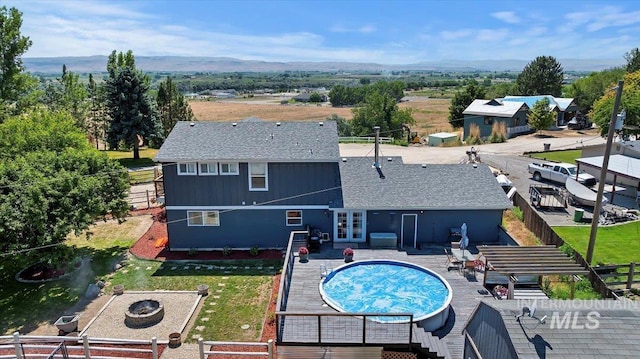 15916 Hill Top Cir, Wilder, ID 83676 - view of swimming pool featuring a covered pool, french doors, a patio area, and a grill