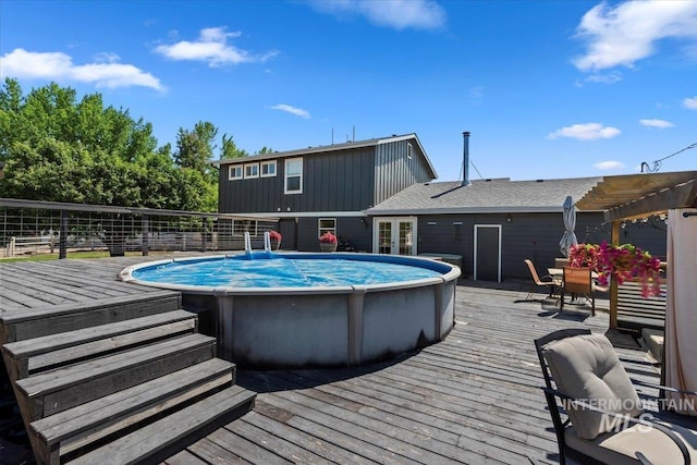 15916 Hill Top Cir, Wilder, ID 83676 - view of swimming pool featuring a deck, french doors, and a pergola