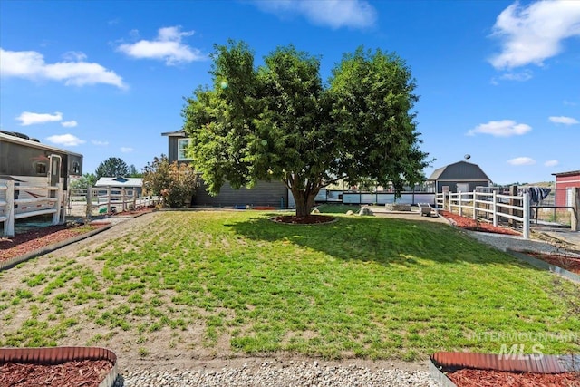 15916 Hill Top Cir, Wilder, ID 83676 - view of green lawn featuring an outdoor structure