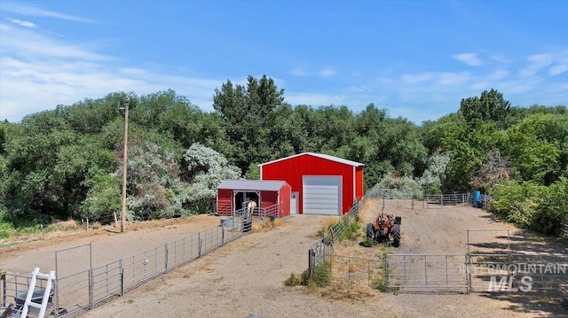 15916 Hill Top Cir, Wilder, ID 83676 - horse barn featuring a forest view