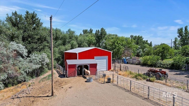 15916 Hill Top Cir, Wilder, ID 83676 - view of pole building with dirt driveway and an exterior structure