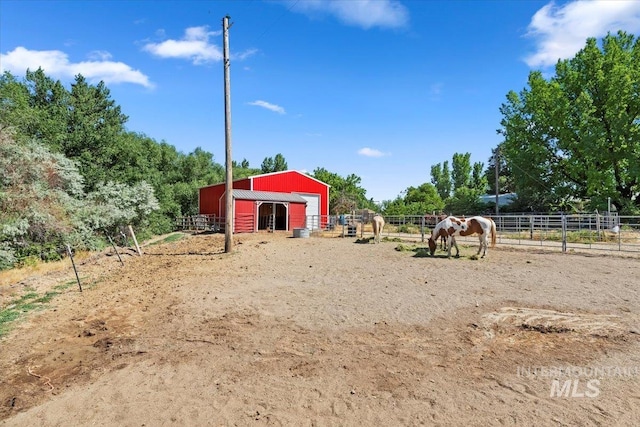 15916 Hill Top Cir, Wilder, ID 83676 - view of yard featuring an exterior structure, an outbuilding, and a rural view