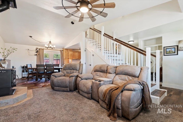15916 Hill Top Cir, Wilder, ID 83676 - living area with stairs, ceiling fan, a wood stove, a chandelier, and wood finished floors