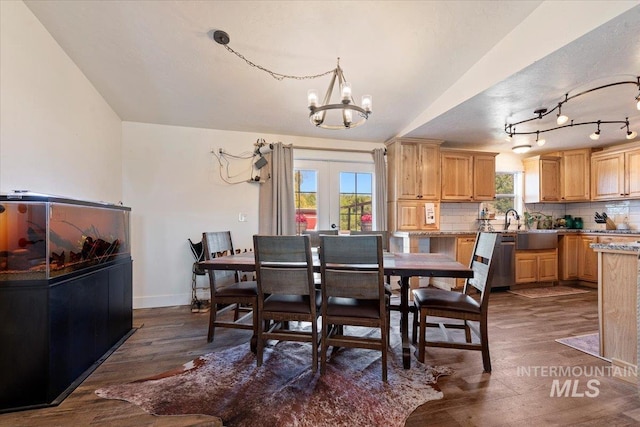 15916 Hill Top Cir, Wilder, ID 83676 - dining area featuring dark wood finished floors, a chandelier, and french doors