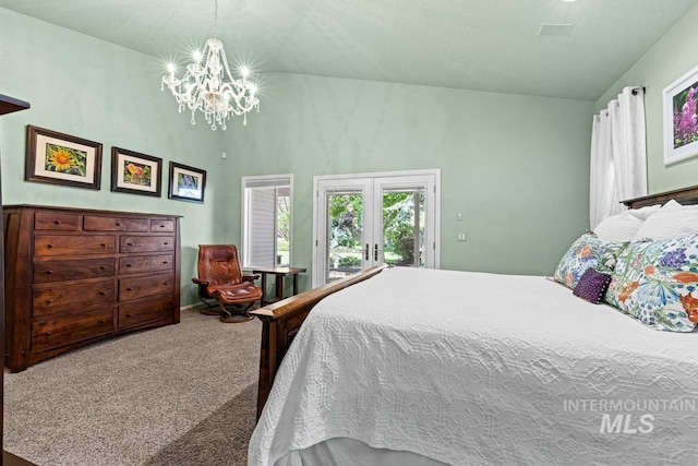 carpeted bedroom with access to exterior, a chandelier, and a towering ceiling