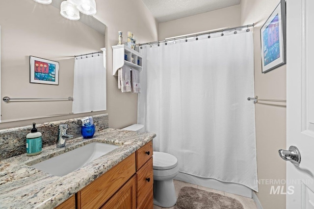 full bathroom with toilet, vanity, tile patterned floors, and shower / tub combo