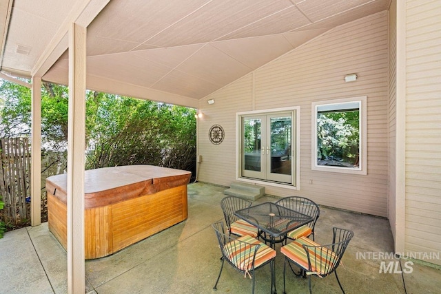 view of patio featuring a hot tub and french doors
