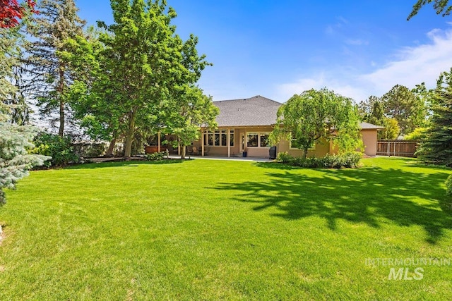 rear view of house with a patio area
