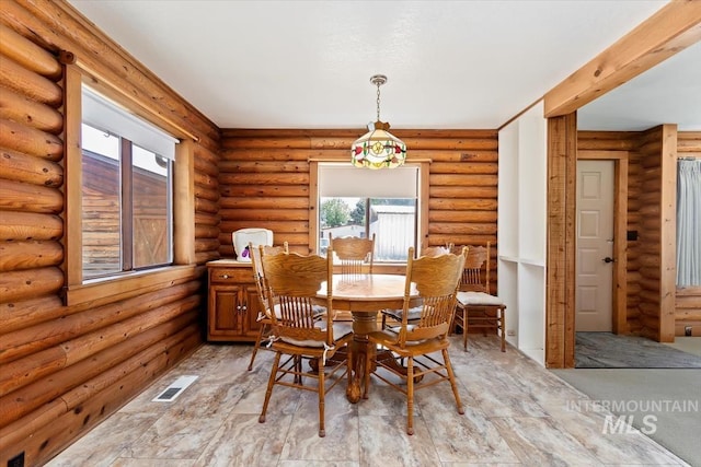 2974 Ua Ave, Emmett, ID 83617 - dining area featuring log walls