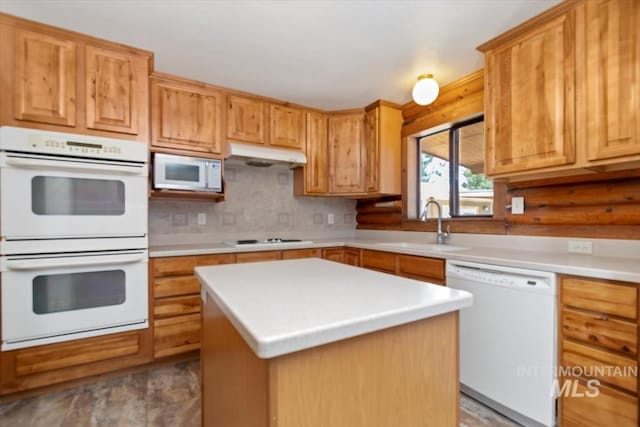2974 Ua Ave, Emmett, ID 83617 - kitchen featuring white appliances, light countertops, a kitchen island, and rustic walls