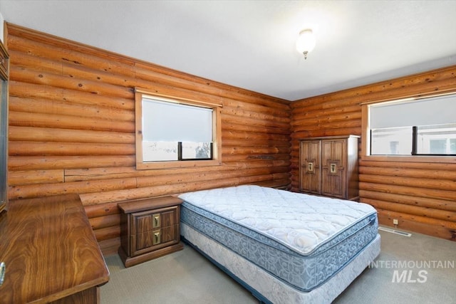 2974 Ua Ave, Emmett, ID 83617 - carpeted bedroom with multiple windows and rustic walls