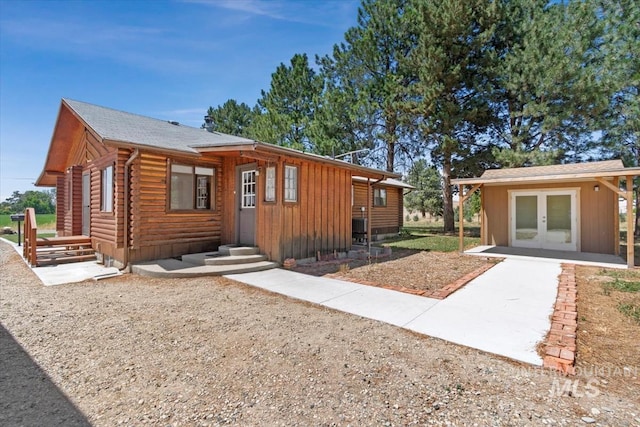 2974 Ua Ave, Emmett, ID 83617 - view of front of house with french doors, log exterior, and entry steps